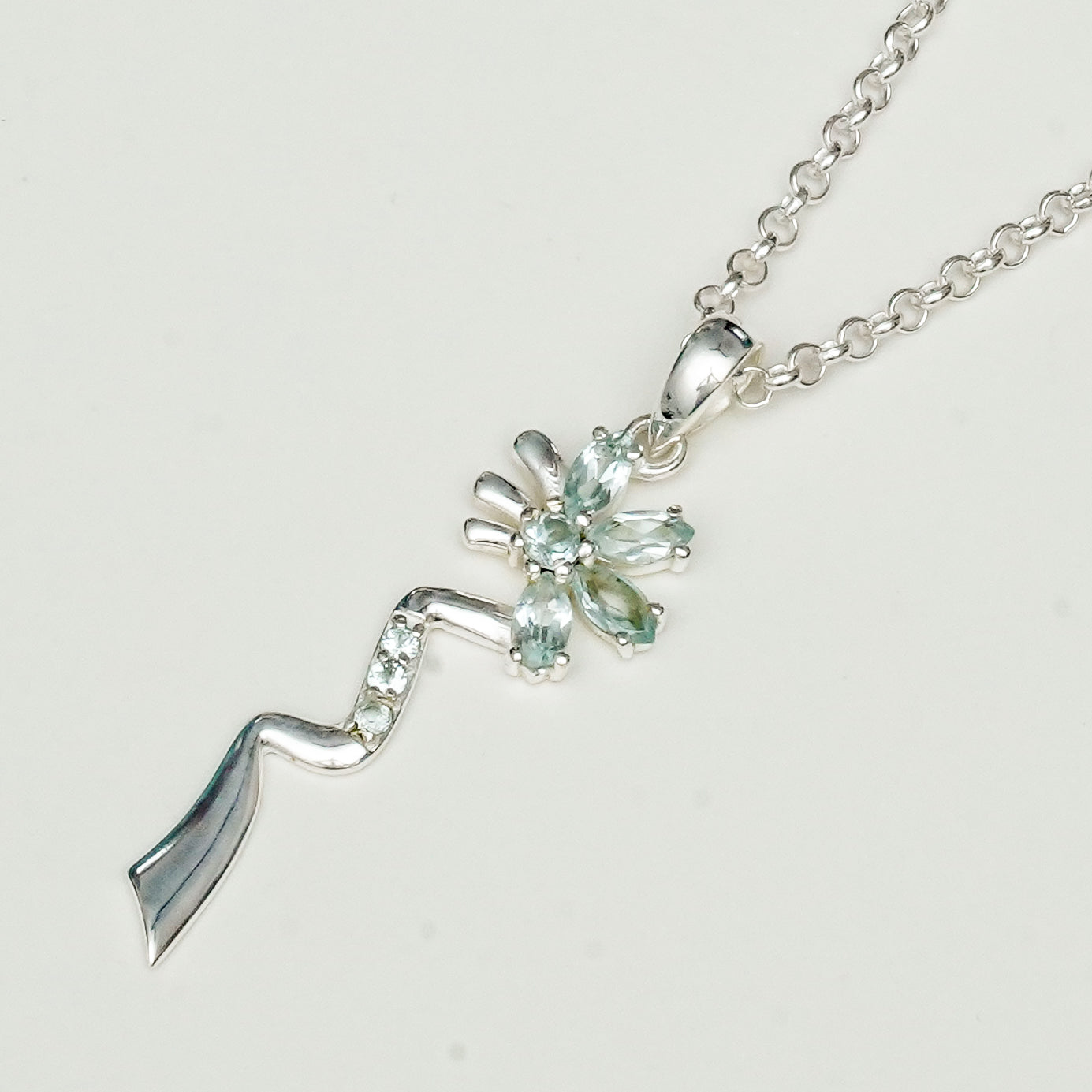 Modern Flower Pendent With Blue Topaz Gemstone In Solid Sterling Silver - Mohnaa Jewels