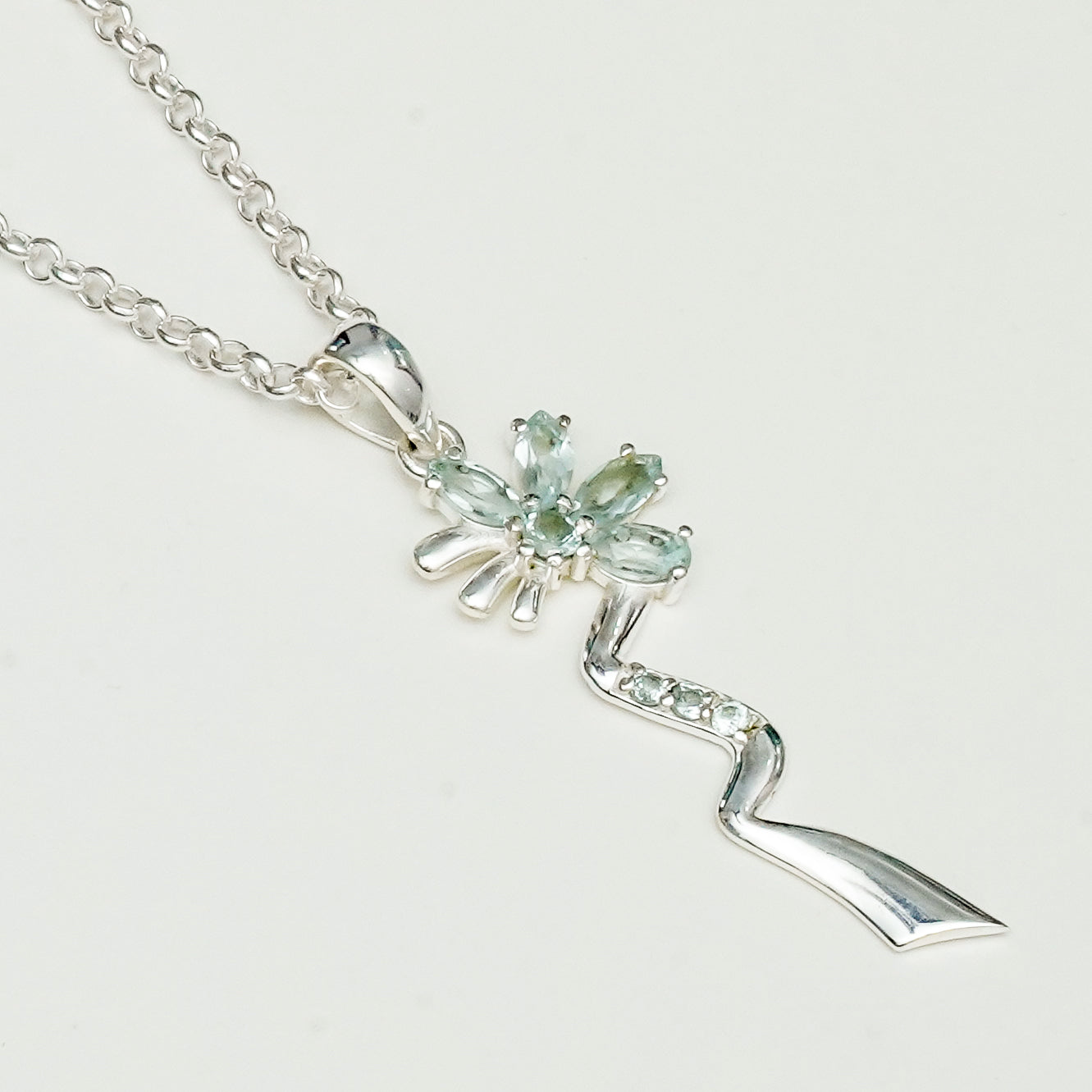 Modern Flower Pendent With Blue Topaz Gemstone In Solid Sterling Silver - Mohnaa Jewels