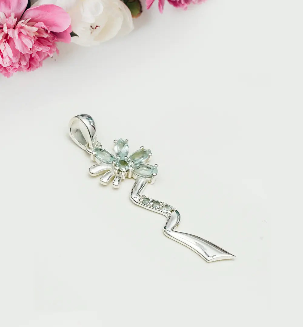Modern Flower Pendent With Blue Topaz Gemstone In Solid Sterling Silver
