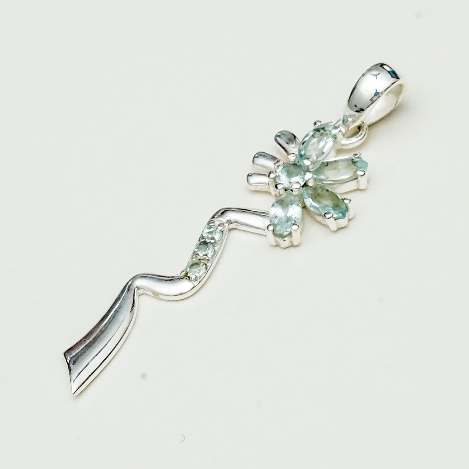 Modern Flower Pendent With Blue Topaz Gemstone In Solid Sterling Silver