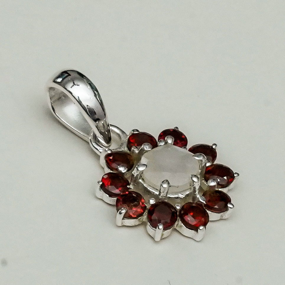 Mohnaa Flower Pendant With Garnet Gemstone In Fine Sterling Silver